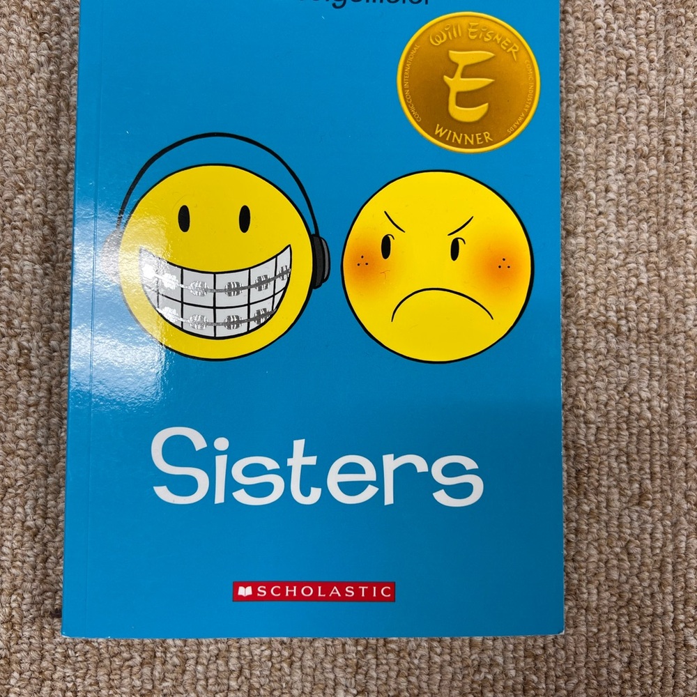 Scholastic Blue 'Sisters' Graphic Novel with Emoticons by Raina Telgemeier